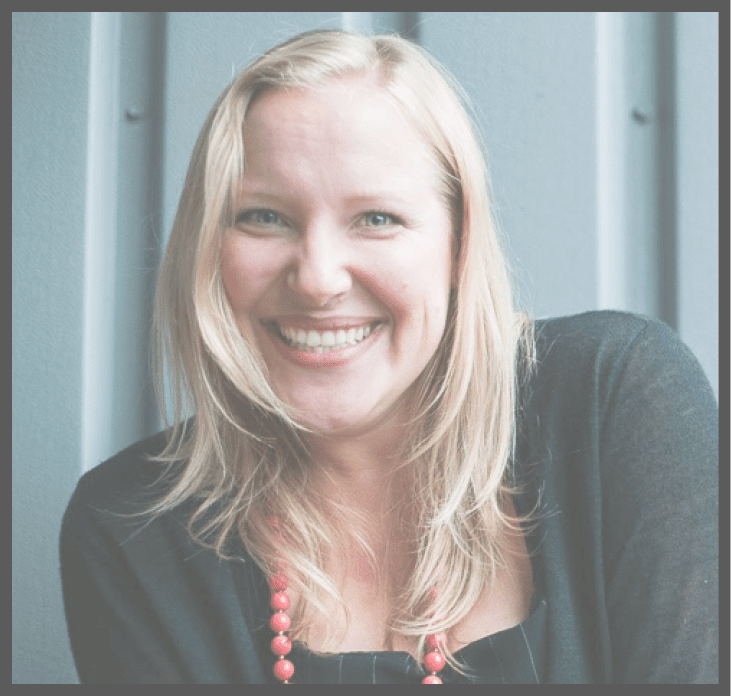 Sophie Toolanen smiling with red necklace and black sweater